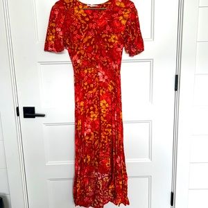 High low dress, ruched waist, flutter sleeves. No pockets